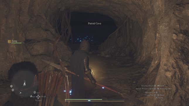 My mysterious spearman stands in front of the entrance to the Rotting Cave in Dragon's Dogma 2.